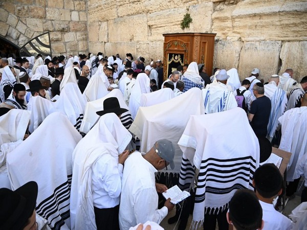 ‘The people of Israel need the blessings now more than ever’: Jews flock to Western Wall