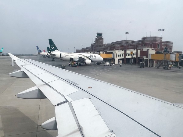 a view of the allama iqbal international airport, seen from the window of an aeroplane in lahore