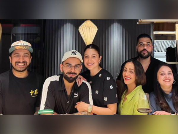 Anushka, Virat twin in black as they step out for date, poses with fans